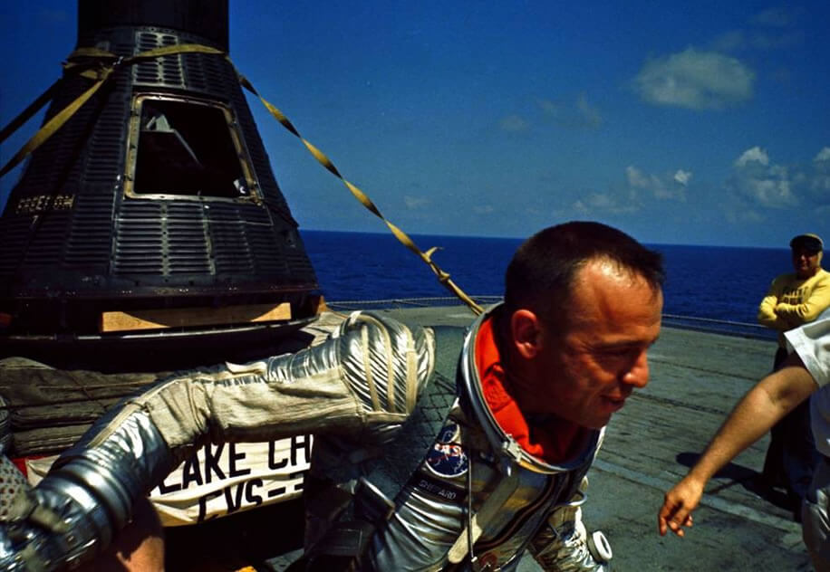 NASA Shepard Aboard the Lake Champlain with His Freedom 7 Capsule Behind Him